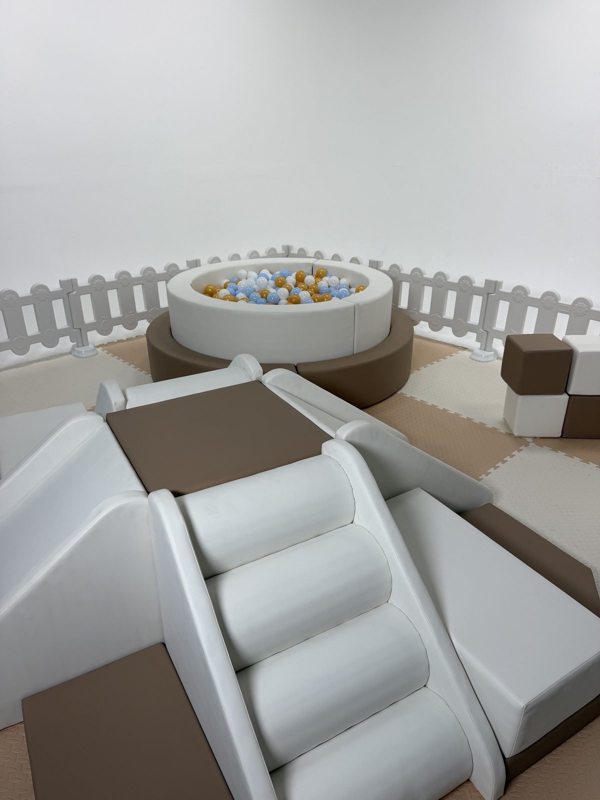Sturdy soft-play climbing steps and padded slide